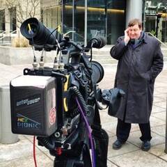 Photograph of Gary O’Donoghue standing in front of a TV camera